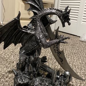 dragon holding knife